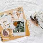 Artystyczny scrapbook z kwiatami i motywującymi wycinkami